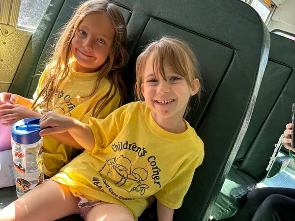 Children's Corner summer camp riding the bus to a field trip